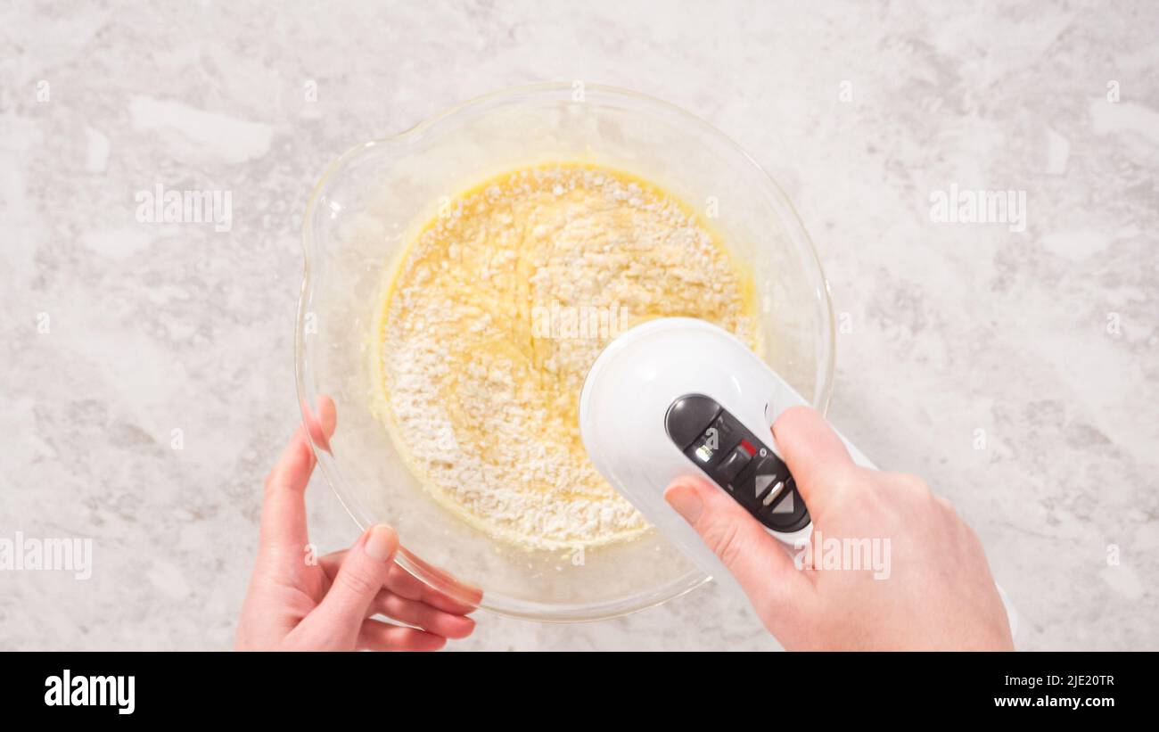 Flat lay. Step by step. Mixing ingredients in a glass mixing bowl to