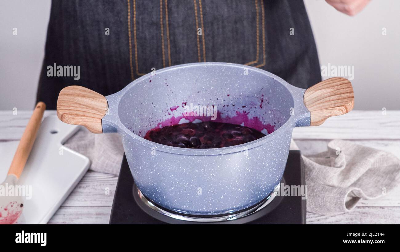 Step by step. Preparing mixed berry compote from frozen berries in a