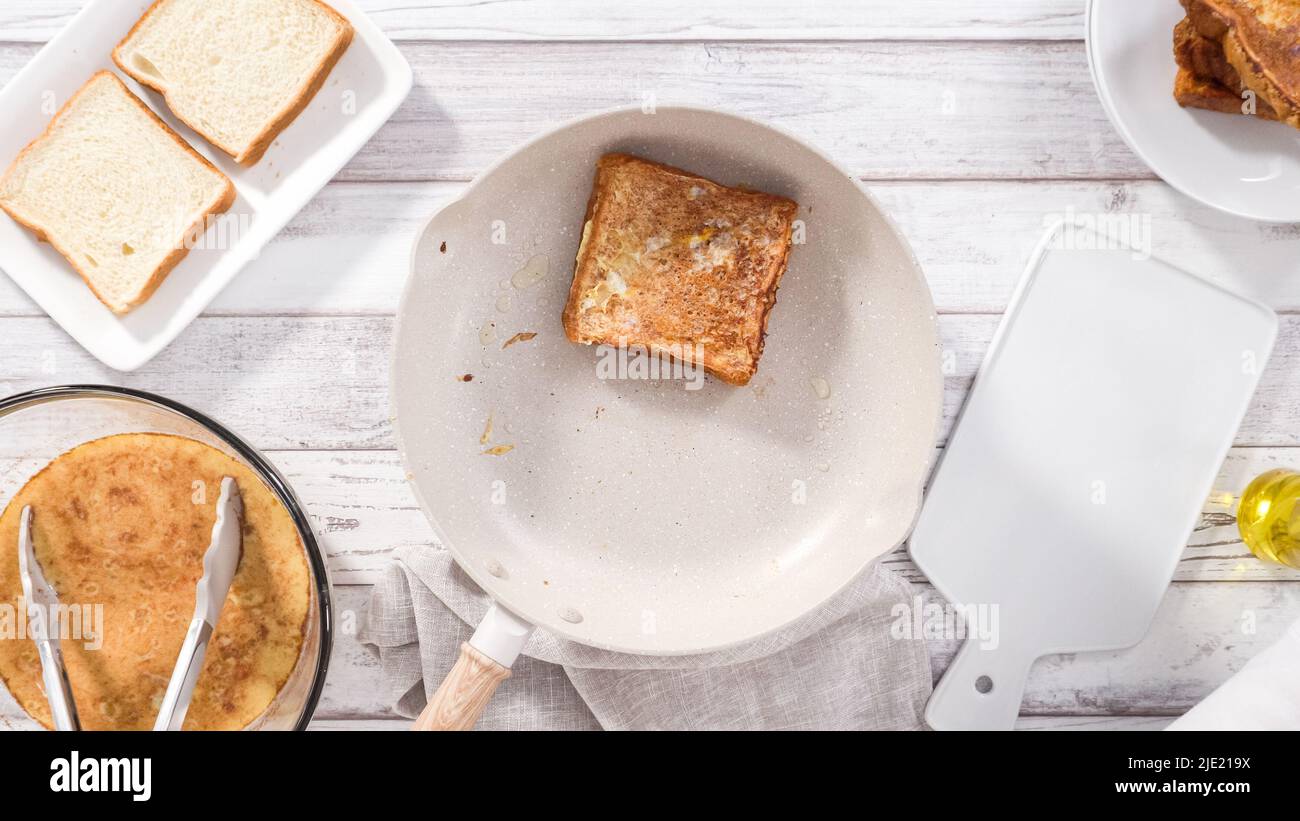 Step by step. Frying french toast in a nonstick frying pan Stock Photo