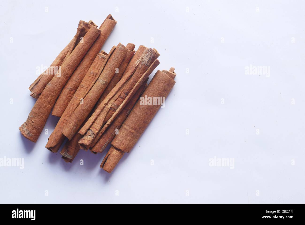 Cinnamon sticks on white background with copy space Stock Photo