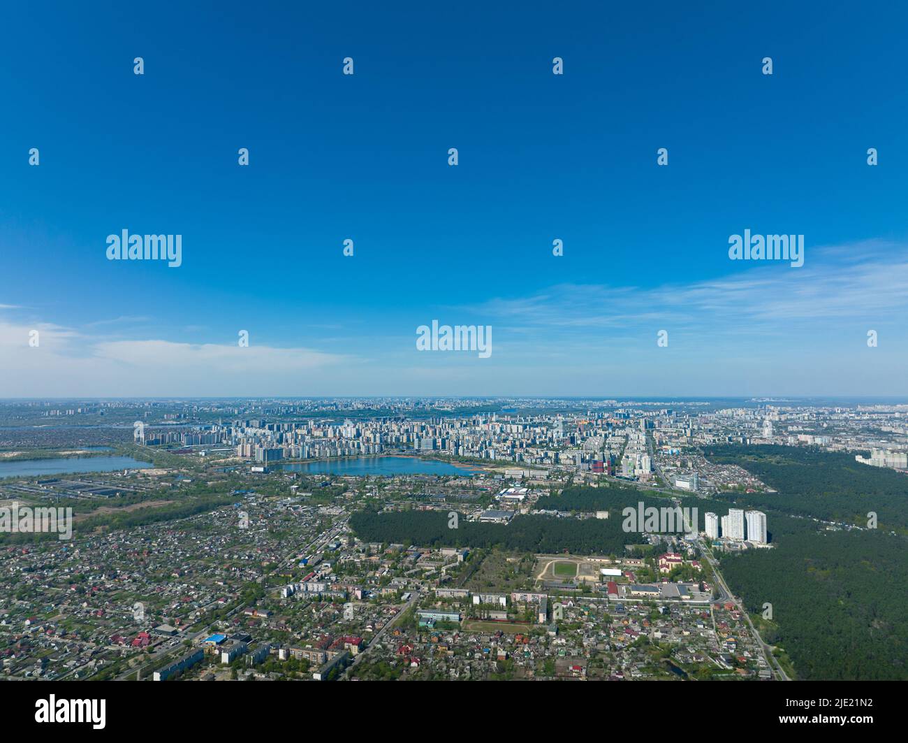 Big city in the distance: high-rise multi-storey modern houses, drone ...