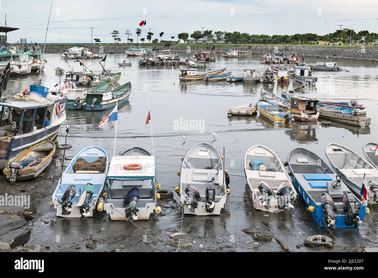 Panama City, Panama - October 28, 2021: Fishing boats in Panama Bay, and Monument of the Flag of Panama in Panama City. Stock Photo