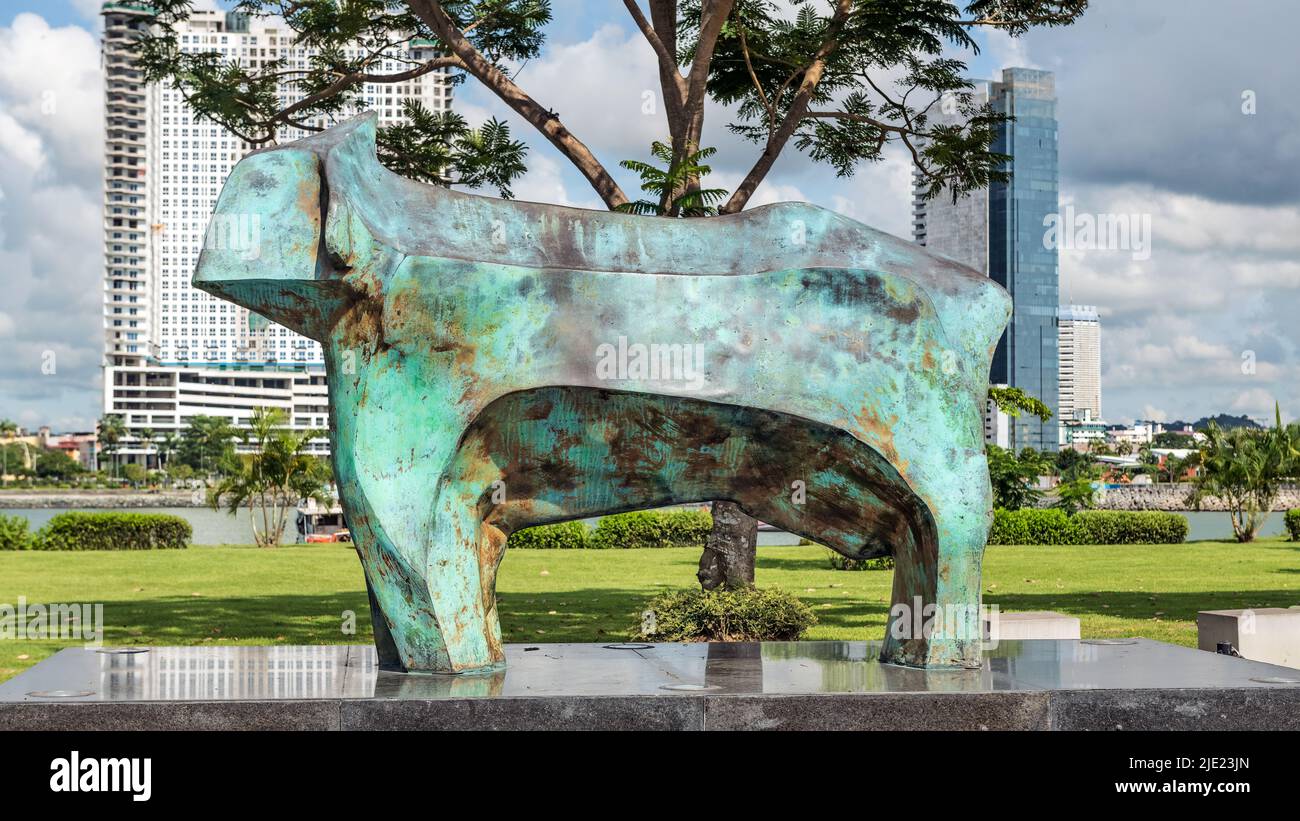 Panama City, Panama - October 29, 2021: Bronze Bull sculpture at Monument of the Flag of Panama in Panama City. Stock Photo