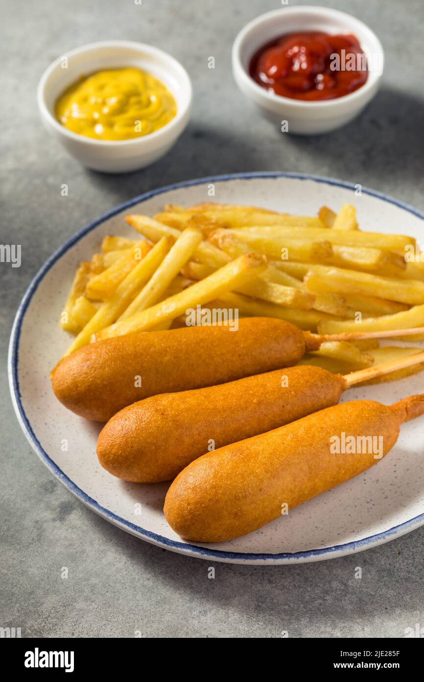 Homemade Breaded Beef Corndogs with French Fries Stock Photo Alamy