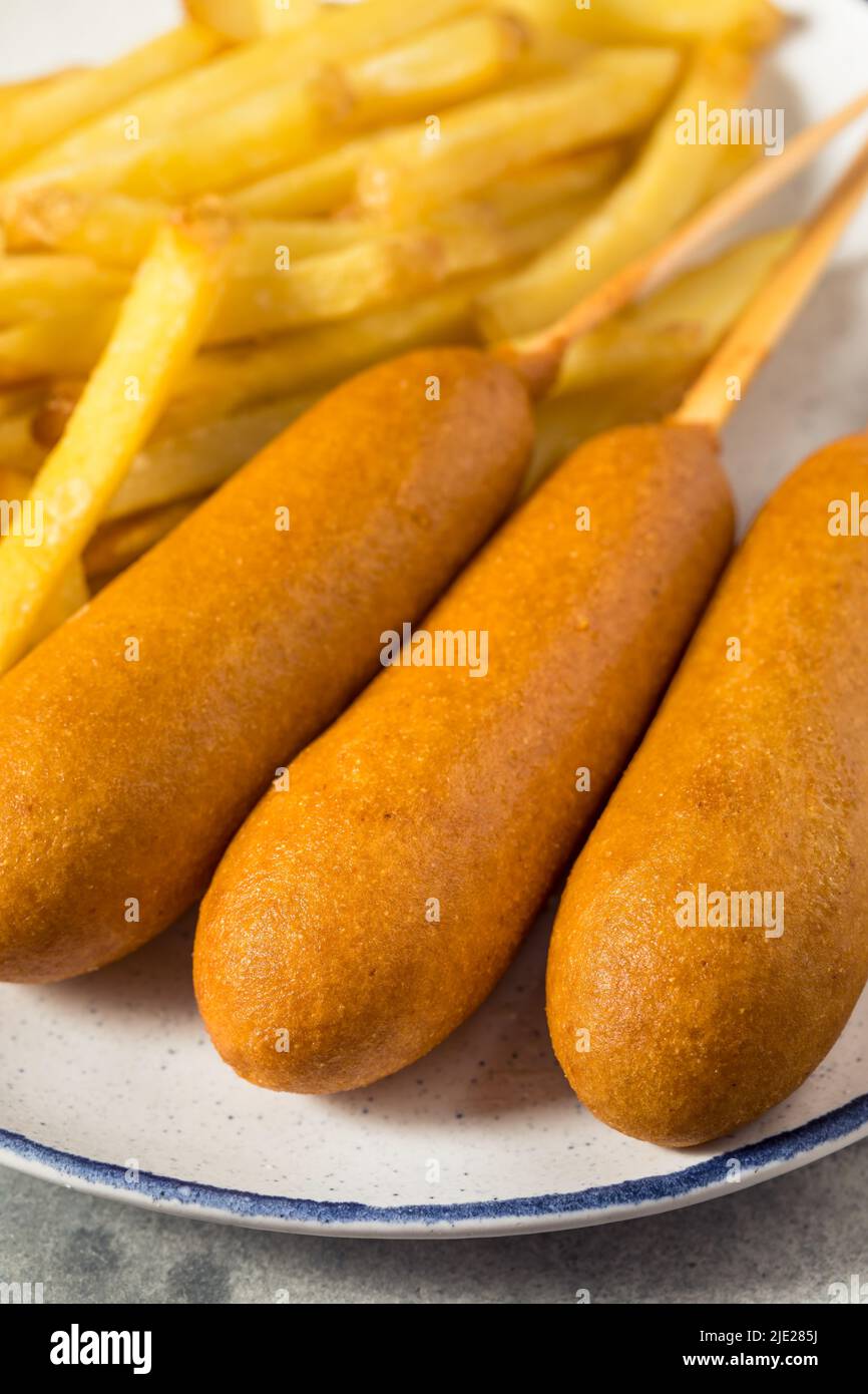 Homemade Breaded Beef Corndogs with French Fries Stock Photo Alamy
