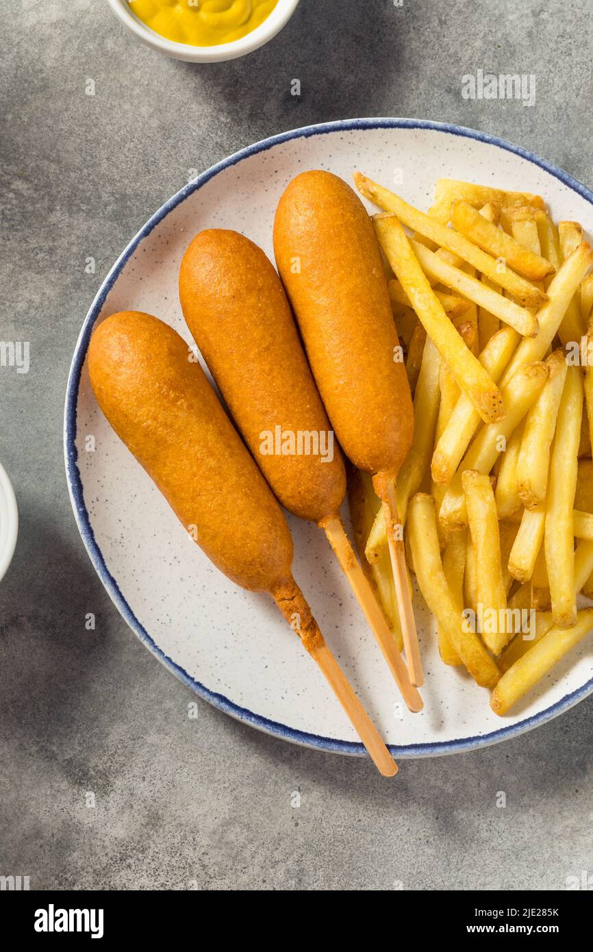 Homemade Breaded Beef Corndogs with French Fries Stock Photo Alamy