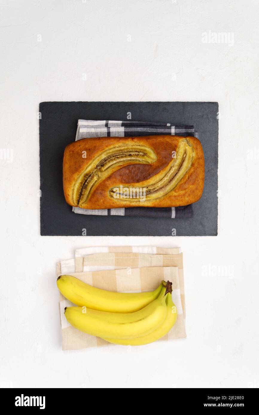 Baked banana bread, sliced on a cutting board. Bakery, cafe, home chef