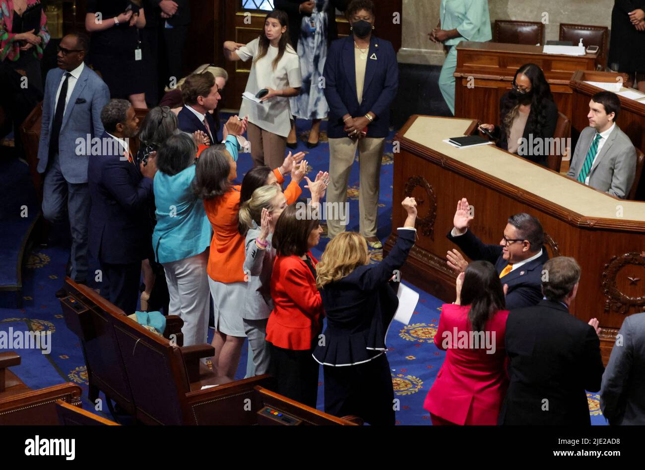U.S. House of Representatives Democrats celebrate after passing of the 'Bipartisan Safer Communities Act' gun safety legislation already passed by the U.S. Senate during a final vote in the House Chamber on Capitol Hill in Washington, June 24, 2022.  REUTERS/Jim Bourg Stock Photo