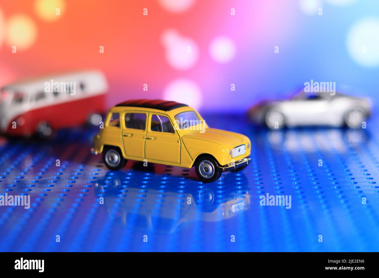 Vintage miniature car, blurred background. Car model RENAULT miniature
