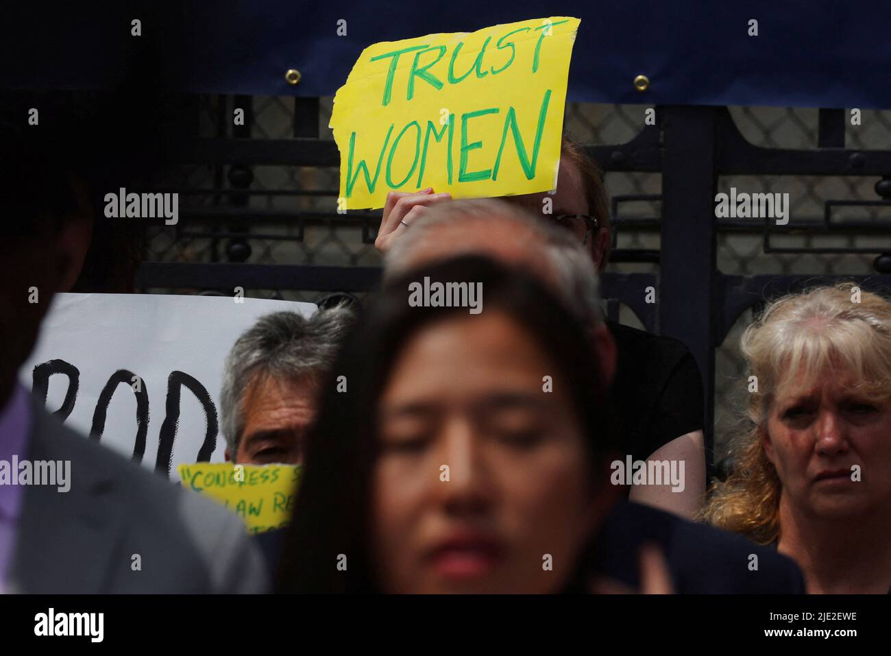 An abortion rights demonstrator holds a sign, as Boston Mayor Michelle Wu speaks outside the Massachusetts State House after the United States Supreme Court ruled in the Dobbs v. Women's Health Organization abortion case, overturning the landmark Roe v Wade abortion decision, in Boston, Massachusetts, U.S., June 24, 2022.   REUTERS/Brian Snyder Stock Photo