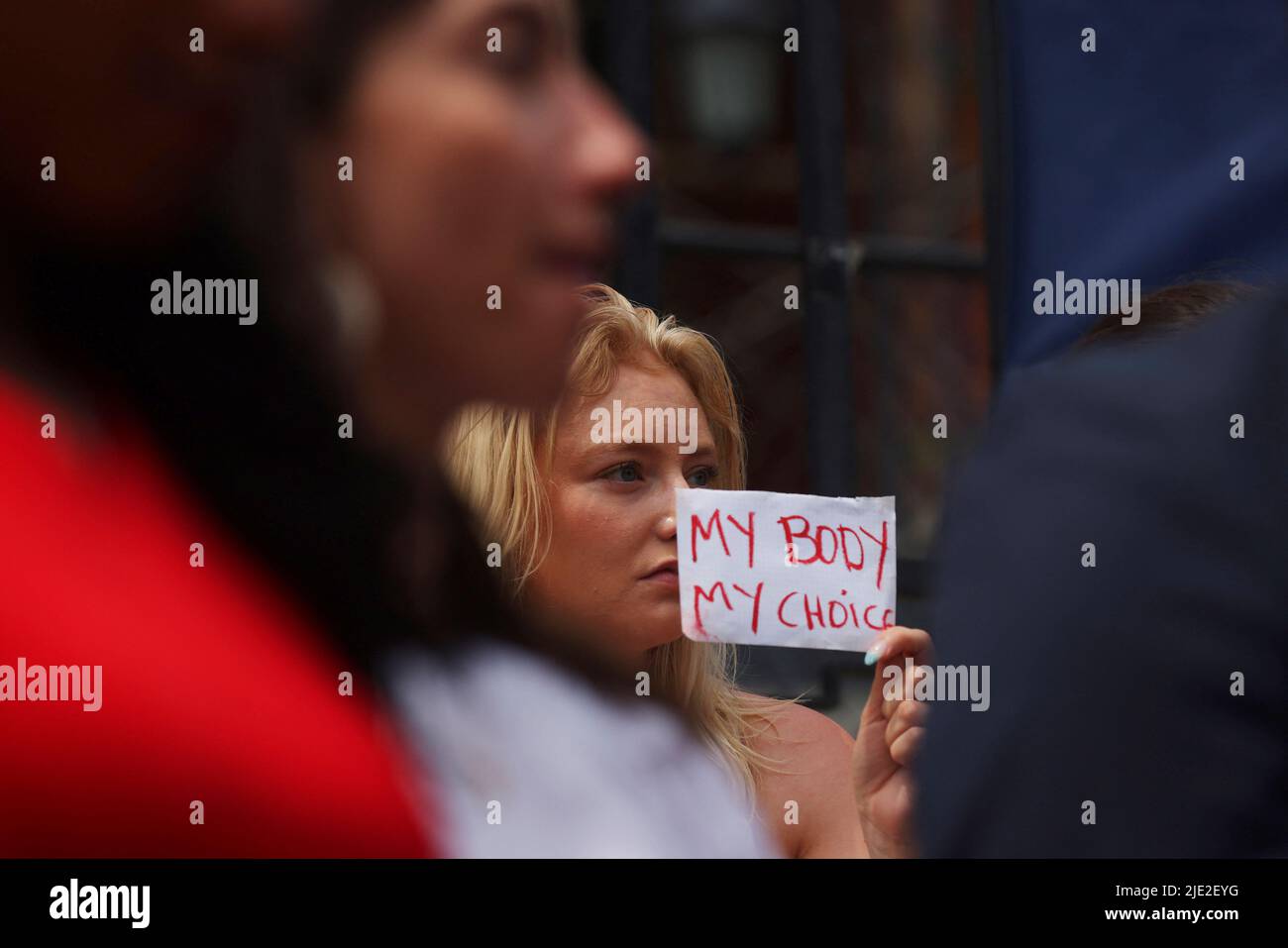 An abortion rights demonstrator holds a sign at the Massachusetts State House after the United States Supreme Court ruled in the Dobbs v. Women's Health Organization abortion case, overturning the landmark Roe v Wade abortion decision, in Boston, Massachusetts, U.S., June 24, 2022.   REUTERS/Brian Snyder Stock Photo