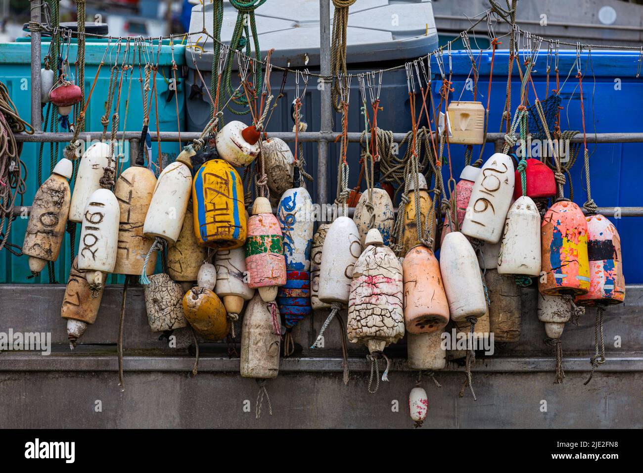 An array of crab pot floats on the side of a commercial fishing vessel in Steveston British Columbia Canada Stock Photo