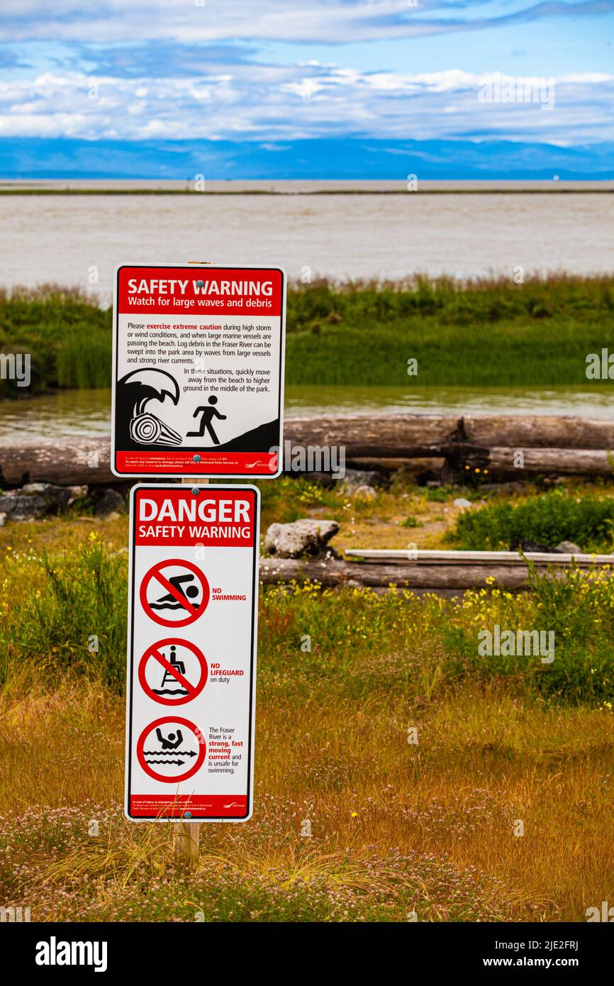 Safety notice for loose logs coming ashore in a storm near Steveston British Columbia Canada Stock Photo