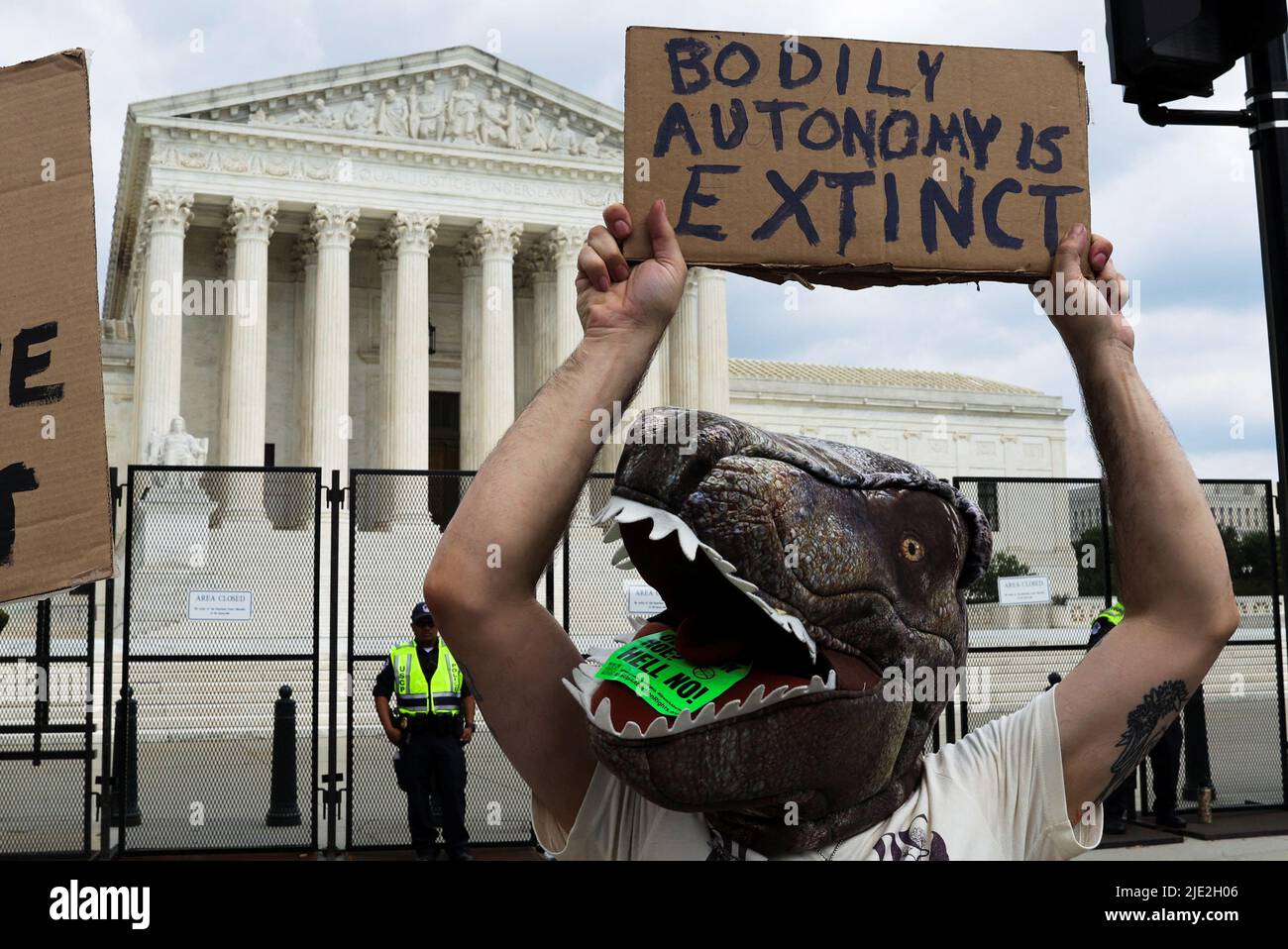 Chris Davis of Fairfax, Virginia, holds up a sign during a protest outside the United States Supreme Court as the court rules in the Dobbs v Women's Health Organization abortion case, overturning the landmark Roe v Wade abortion decision in Washington, U.S., June 24, 2022. REUTERS/Jim Bourg Stock Photo
