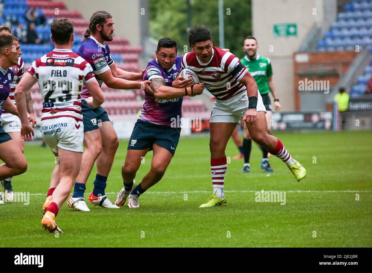 Harrison Hansen tackles Wigans Patrick Mago during the Betfred Super League match between Wigan and Toulouse at the DW Stadium, Wigan on 24 June 2022. Photo by Simon Hall. Editorial use only, license required for commercial use. No use in betting, games or a single club/league/player publications. Credit: UK Sports Pics Ltd/Alamy Live News Stock Photo