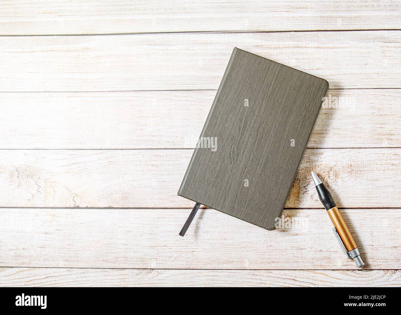 Notebook on wooden table, vintage picture tone, ready to add text or