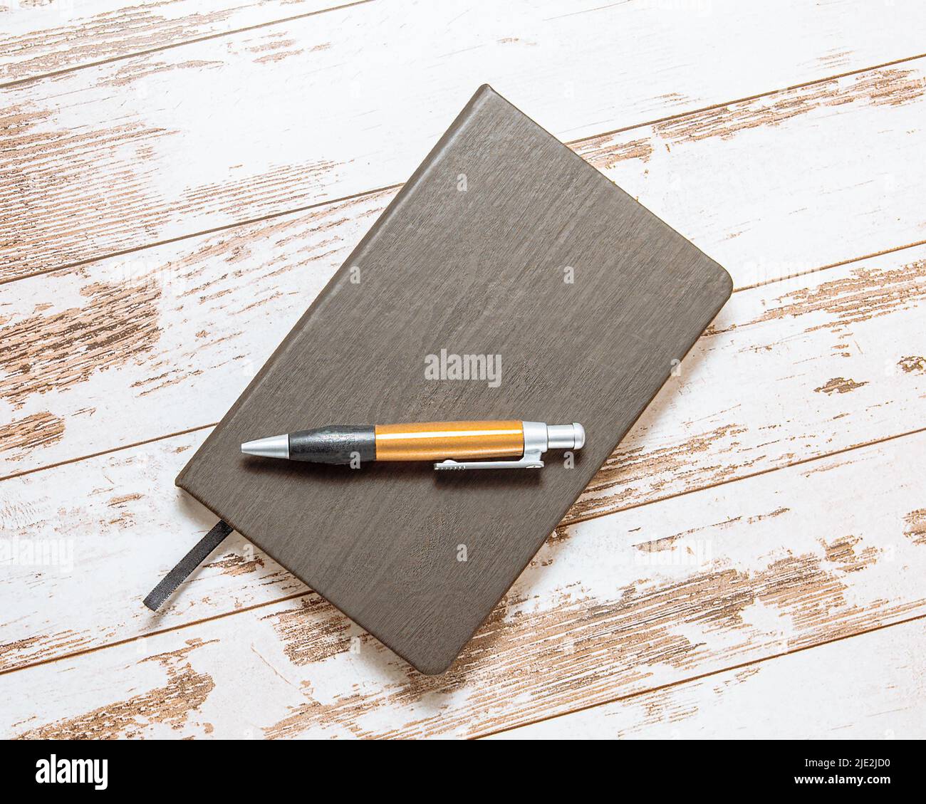 Notebook on wooden table, vintage picture tone, ready to add text or