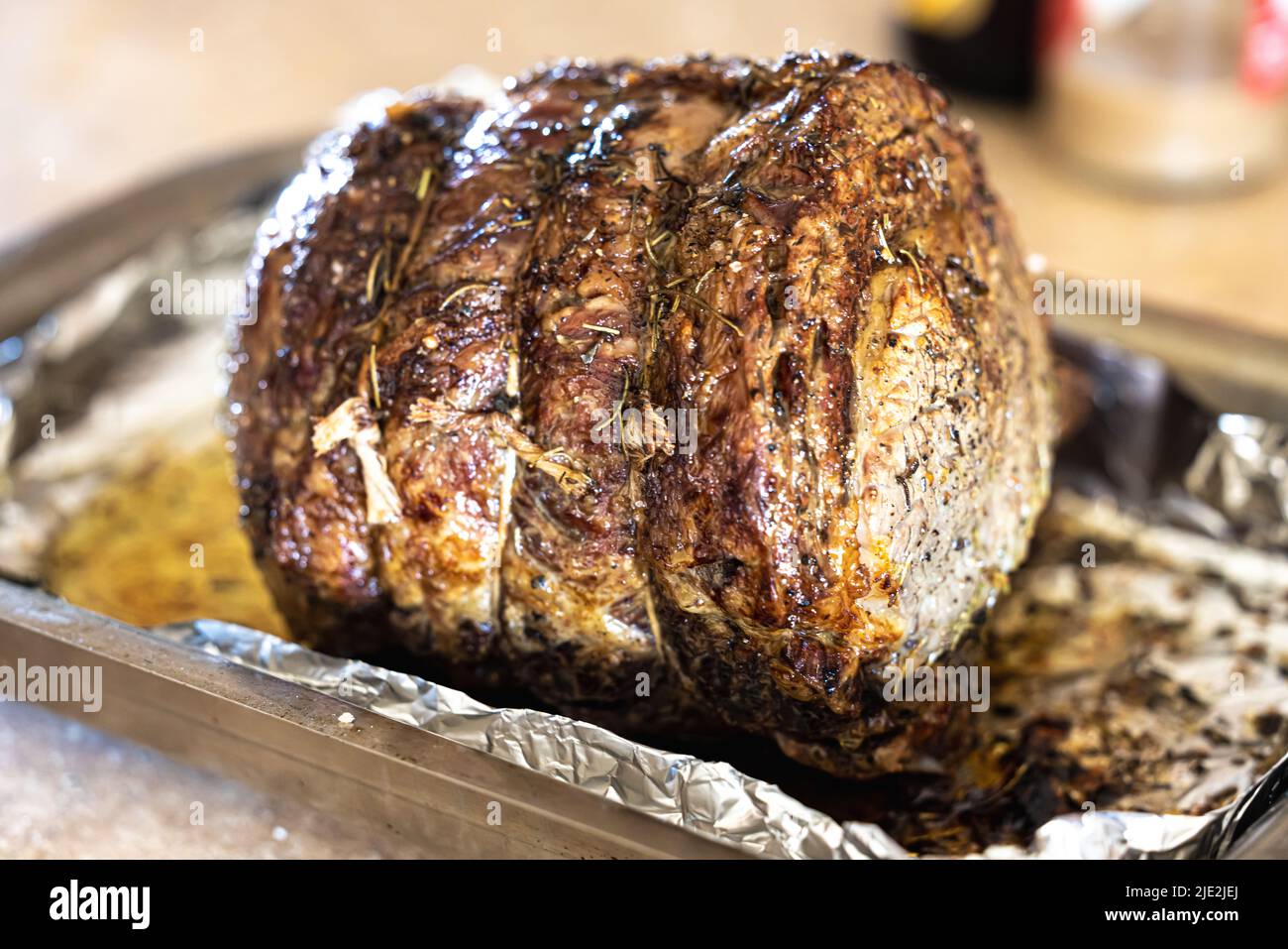 https://c8.alamy.com/comp/2JE2JEJ/a-large-prime-rib-beef-roast-that-was-baked-and-roasted-in-the-oven-by-a-home-gourmet-chef-for-a-holiday-christmas-dinner-2JE2JEJ.jpg