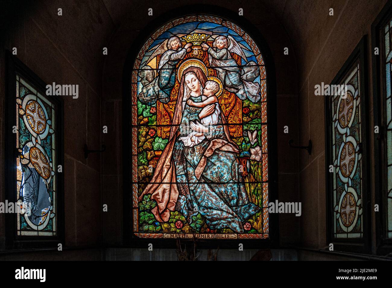 Stained glass windows inside a family tomb. Montmartre Cemetery. Paris