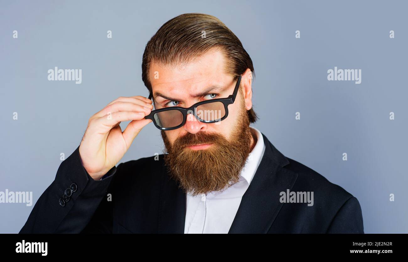 Handsome businessman in spectacles. Elegant bearded man in glasses and suit. Male beauty, fashion. Stock Photo