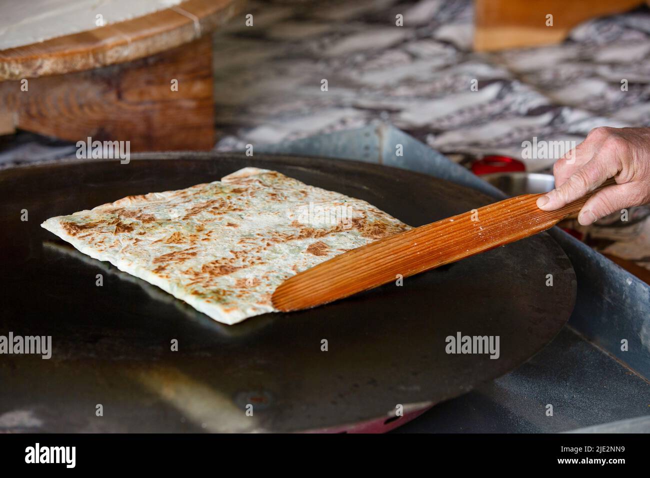 Preparing the cooked pancake for service by cutting it in Antalya Turkey Stock Photo