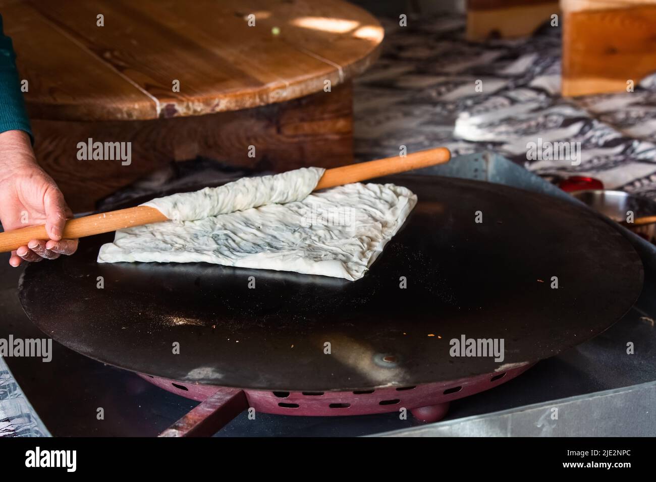 Preparing the cooked pancake for service by cutting it in Antalya Turkey Stock Photo