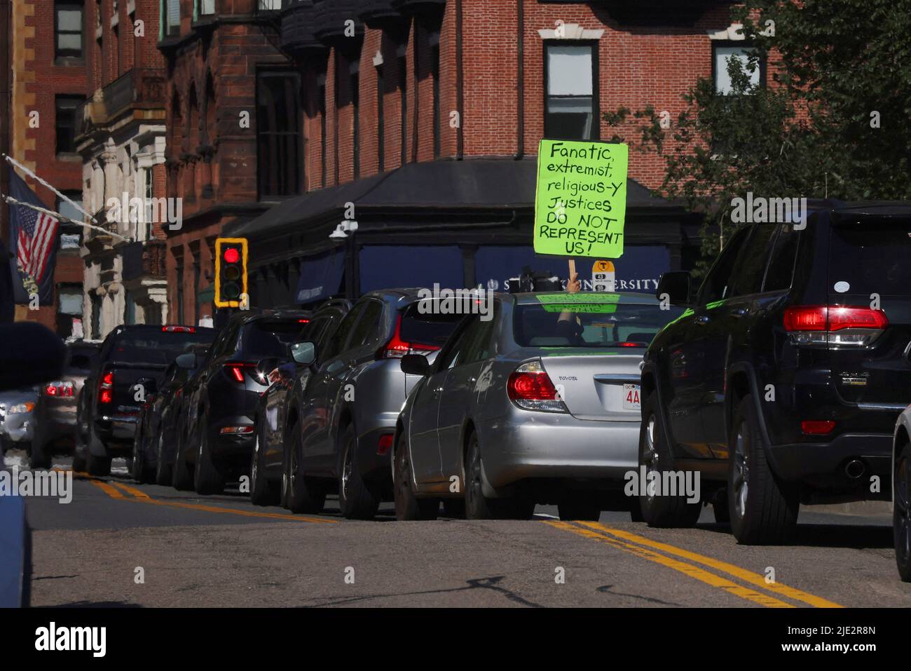 An abortion rights supporter holds a sign out of their car after the United States Supreme Court ruled in the Dobbs v. Jackson Women's Health Organization abortion case, overturning the landmark Roe v Wade abortion decision, in Boston, Massachusetts, U.S., June 24, 2022.   REUTERS/Brian Snyder Stock Photo