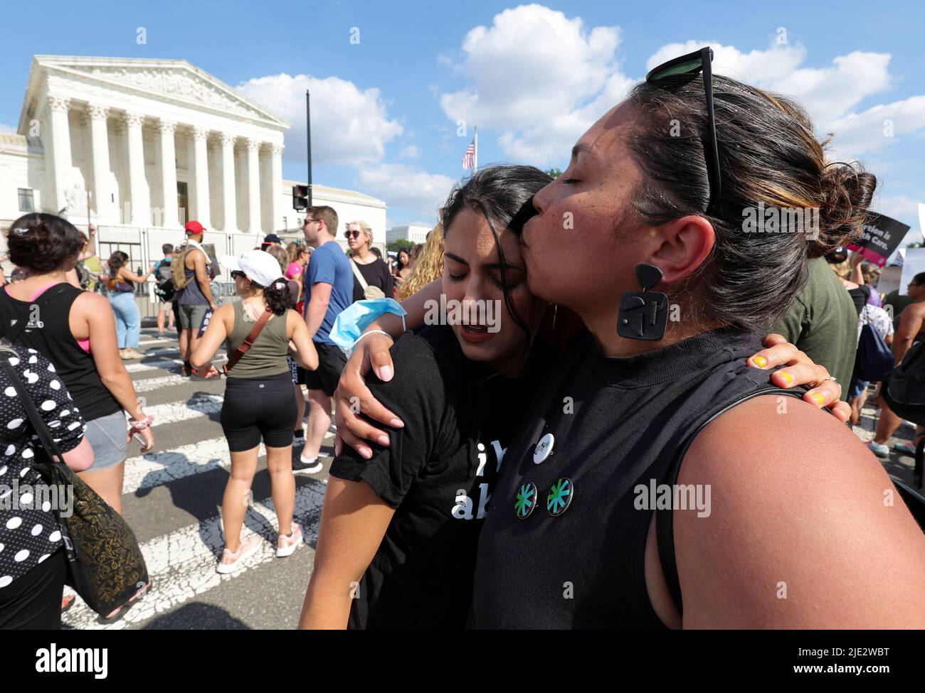 MJ Flores (L), a San Antonio Texas woman who had an abortion in Texas, cries while hugging Daniela Diaz (R), a friend from Venezuela who had an abortion in Washington, DC, during a protest outside the United States Supreme Court as the court rules in the Dobbs v Women's Health Organization abortion case, overturning the landmark Roe v Wade abortion decision, in Washington, DC, U.S., June 24, 2022. REUTERS/Jim Bourg Stock Photo