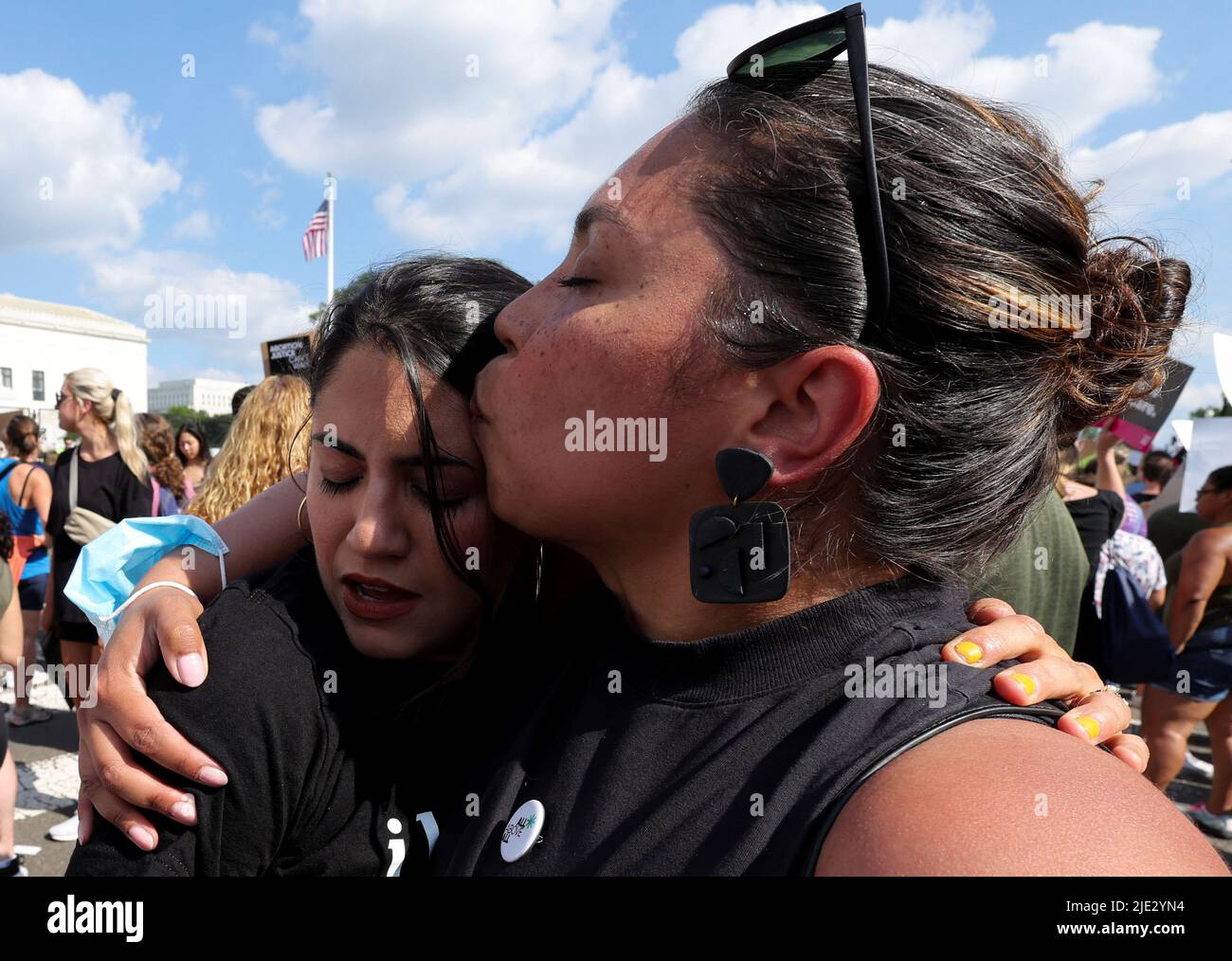 MJ Flores (L), a San Antonio Texas woman who had an abortion in Texas, cries while hugging Daniela Diaz (R), a friend from Venezuela who had an abortion in Washington, DC, during a protest outside the United States Supreme Court as the court rules in the Dobbs v Women's Health Organization abortion case, overturning the landmark Roe v Wade abortion decision, in Washington, DC, U.S., June 24, 2022. REUTERS/Jim Bourg Stock Photo