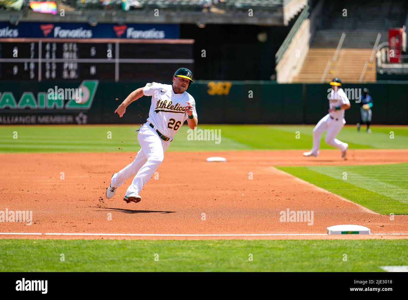 Oakland Athletics Infielder Sheldon Neuse (26) runs to third base during an MLB game between Seattle Mariners and Oakland Athletics at the RingCentral Stock Photo