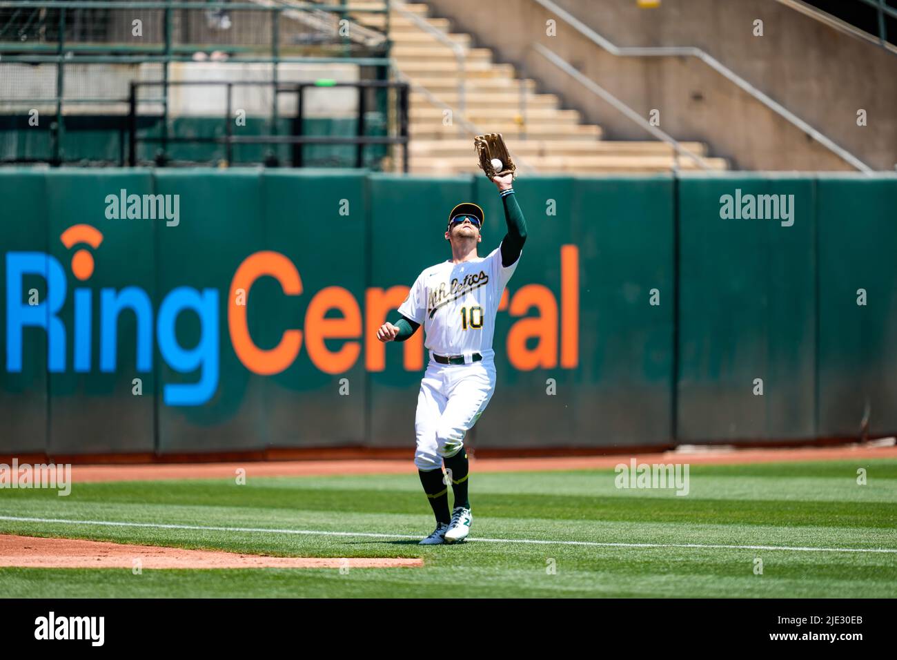 Oakland Athletics Outfielder Chad Pinder (10) catches the ball for an out during an MLB game between Seattle Mariners and Oakland Athletics at the Rin Stock Photo