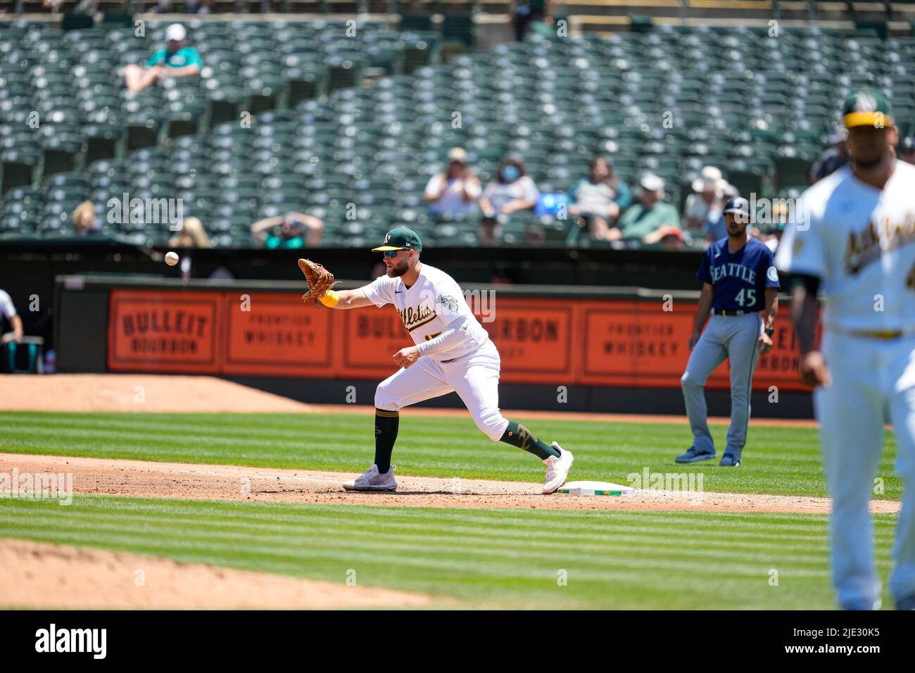 Oakland Athletics Infielder Seth Brown (15) catches the ball for an out during an MLB game between Seattle Mariners and Oakland Athletics at the RingC Stock Photo