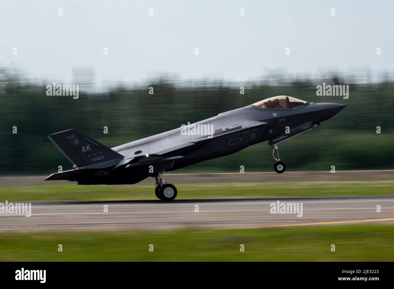 A U.S. Air Force F-35A Lightning II lands during exercise RED FLAG-Alaska 22-2 at Eielson Air Force Base, Alaska, June 16, 2022. The F-35 contains state-of-the-art tactical data links that provide the secure sharing of data among its flight members as well as other airborne, surface and ground-based platforms required to perform assigned missions. (U.S. Air Force photo by Staff Sgt. Skyler Combs) Stock Photo