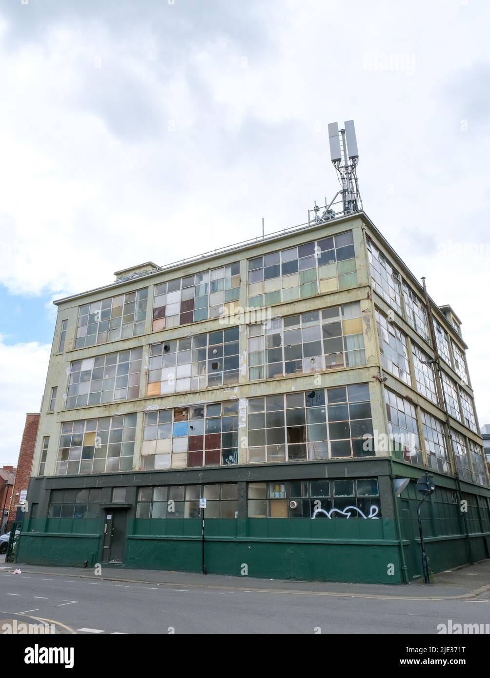 A former semi-derelict industrial building in an inner city area of Sheffield built with a geometric patterning of glass and steel. Stock Photo