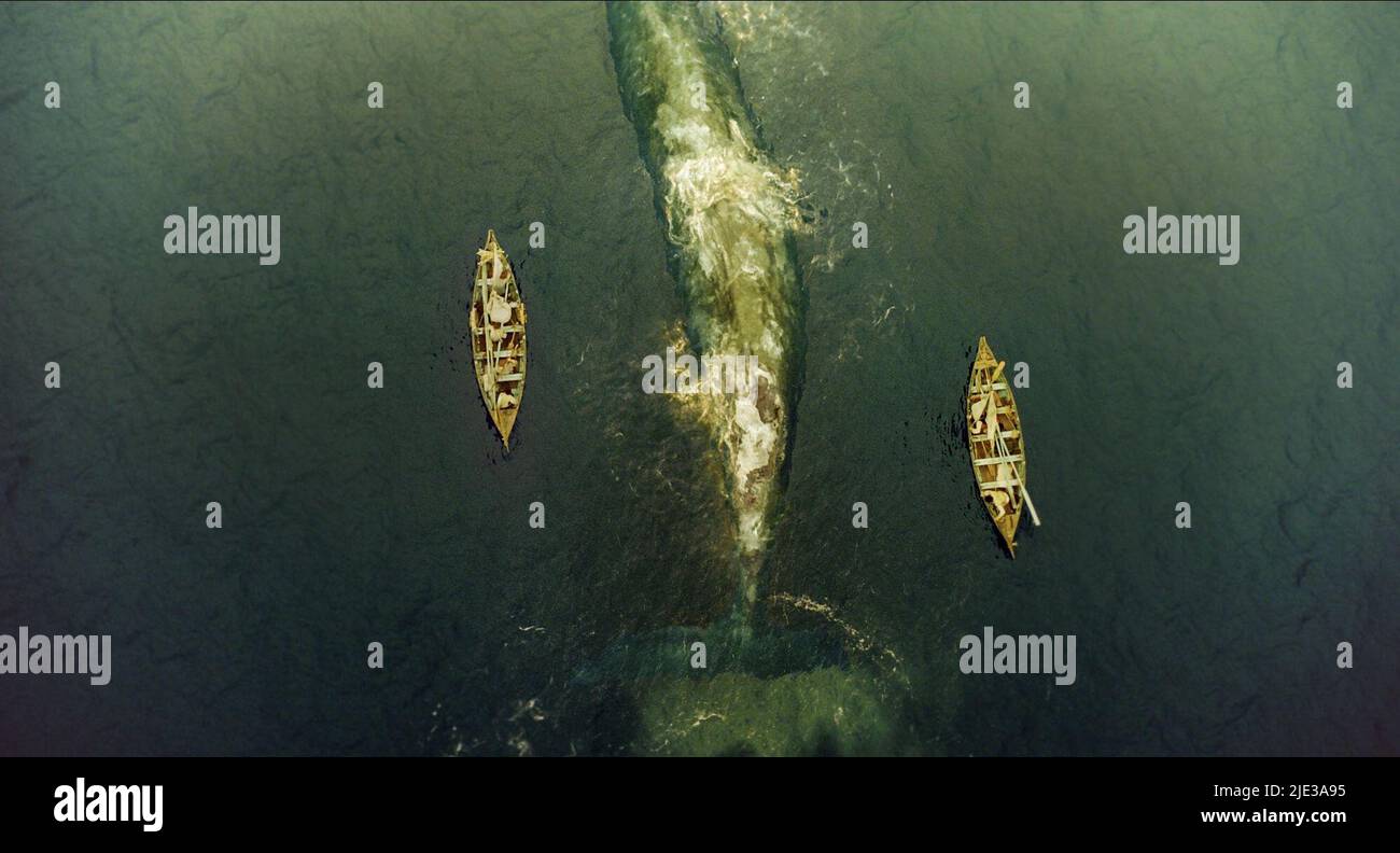 ROWING BOATS FLANK WHALE, IN THE HEART OF THE SEA, 2015 Stock Photo