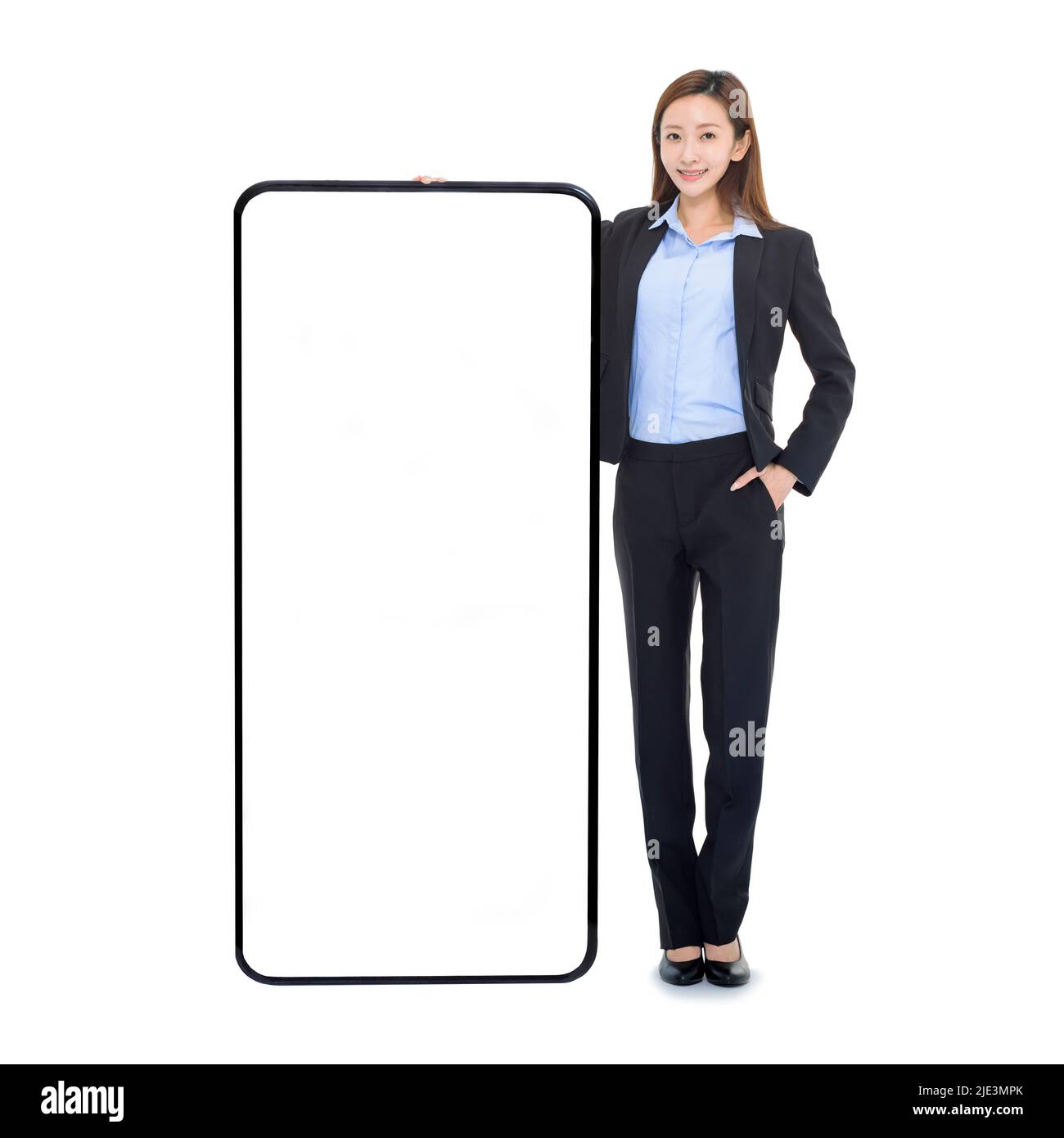 Business woman leaning on huge cellphone with blank white screen,  recommending great new app or website for smart phone Stock Photo