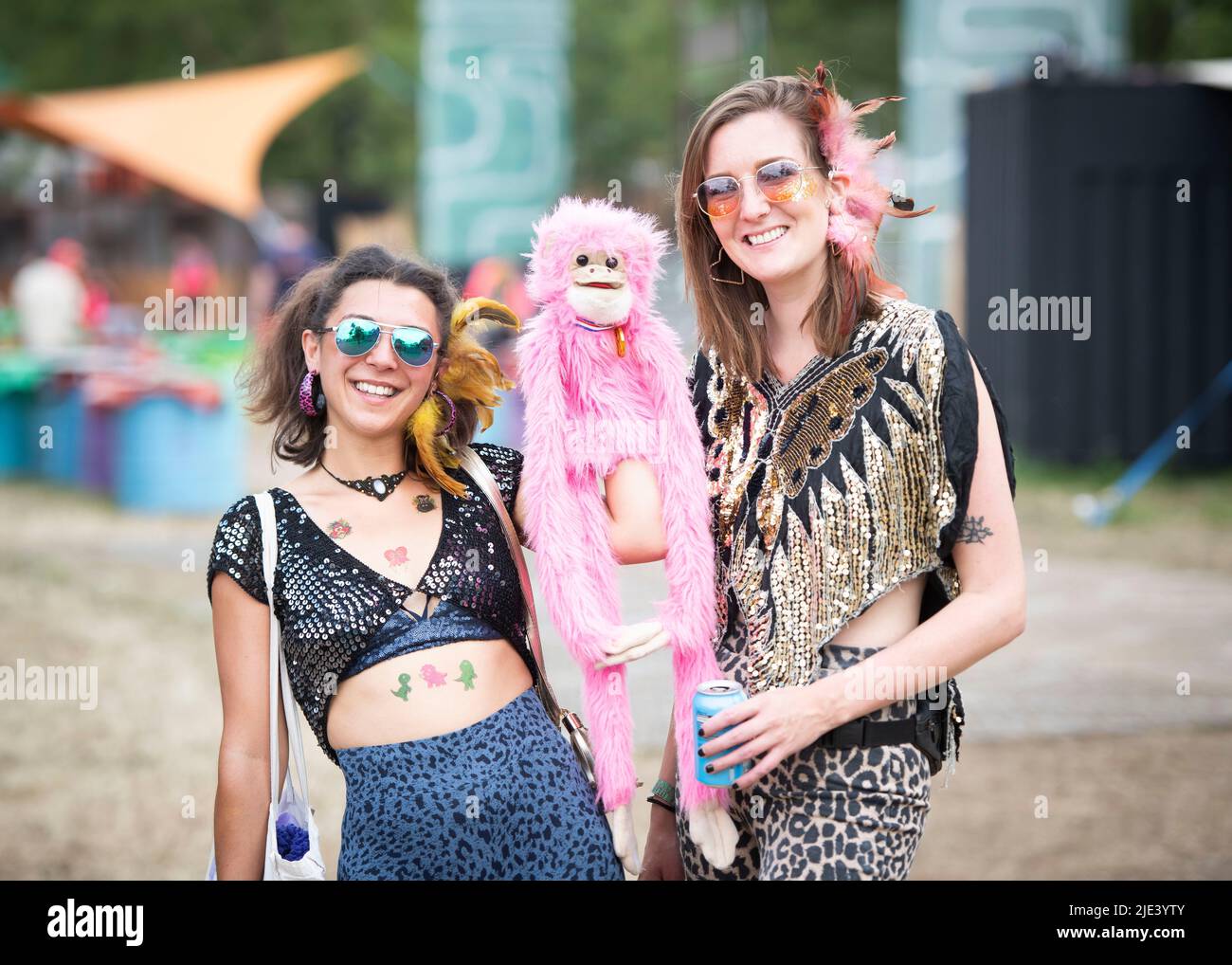 Glastonbury, UK. 24th June 2022. Festival goers wearing sparkly outfits enjoy the Common area at Glastonbury Festival, at Worthy Farm in Somerset. Picture date: Friday June 24, 2022. Photo credit should read: David Jensen/Empics/Alamy Live News Stock Photo