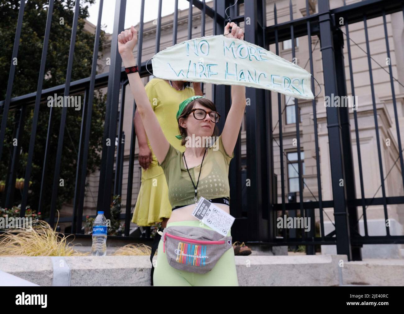 Atlanta, Georgia, USA. 24th June, 2022. A protester holds up a wire hanger with a sign that reads NO MORE WIRE HANGERS, on the steps of the Georgia Capitol as a group of abortion rights protesters gather to protest the Supreme Court's decision to overturn Roe V Wade; the 1973 landmark court decision that legalized abortion in the United States. (Credit Image: © John Arthur Brown/ZUMA Press Wire) Stock Photo