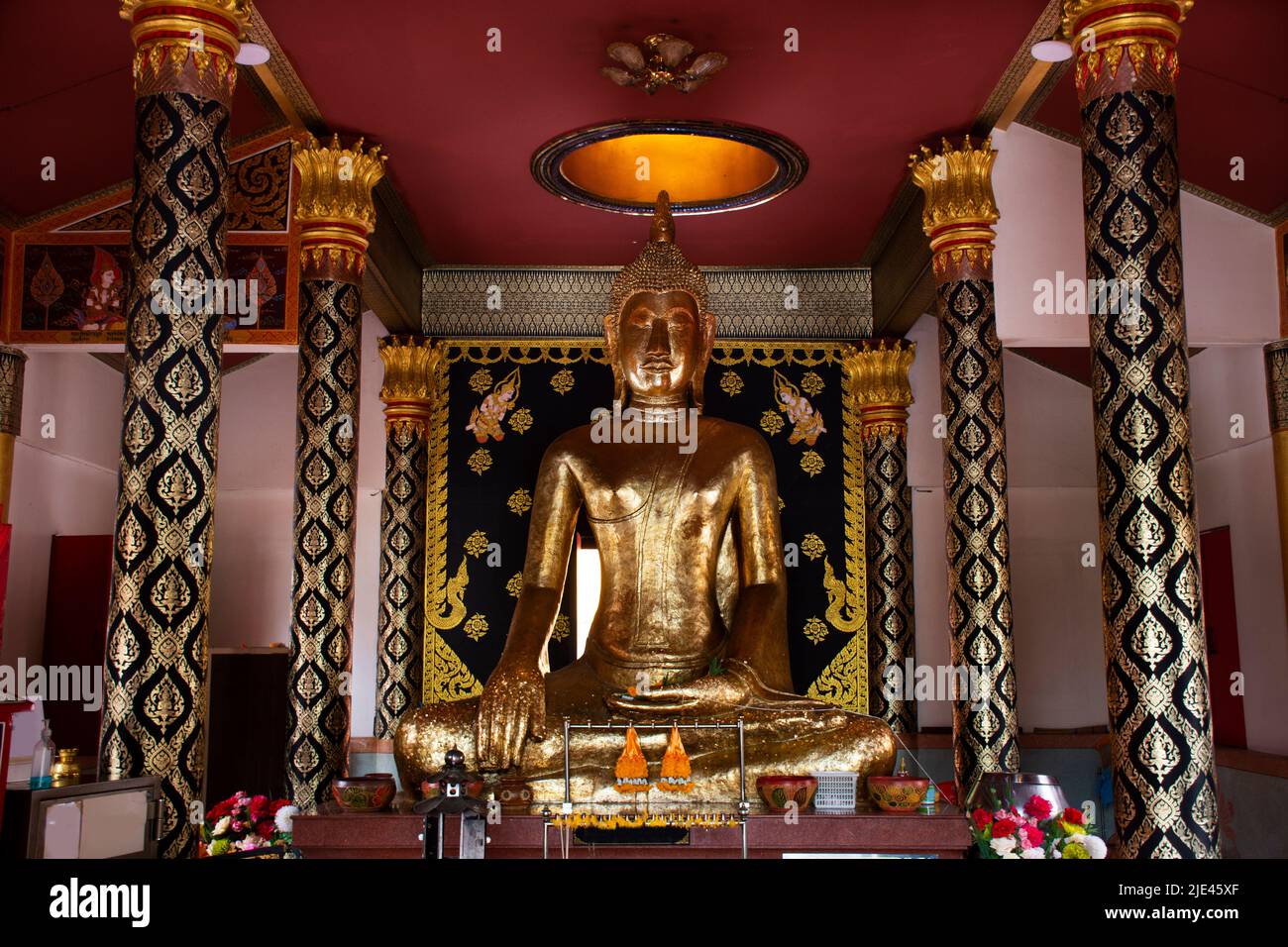 Ancient gold buddha statue in antique ubosot for thai people traveler