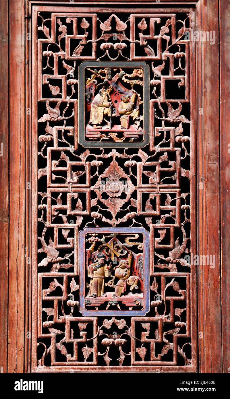 Traditional Chinese wooden window with wood carving Stock Photo