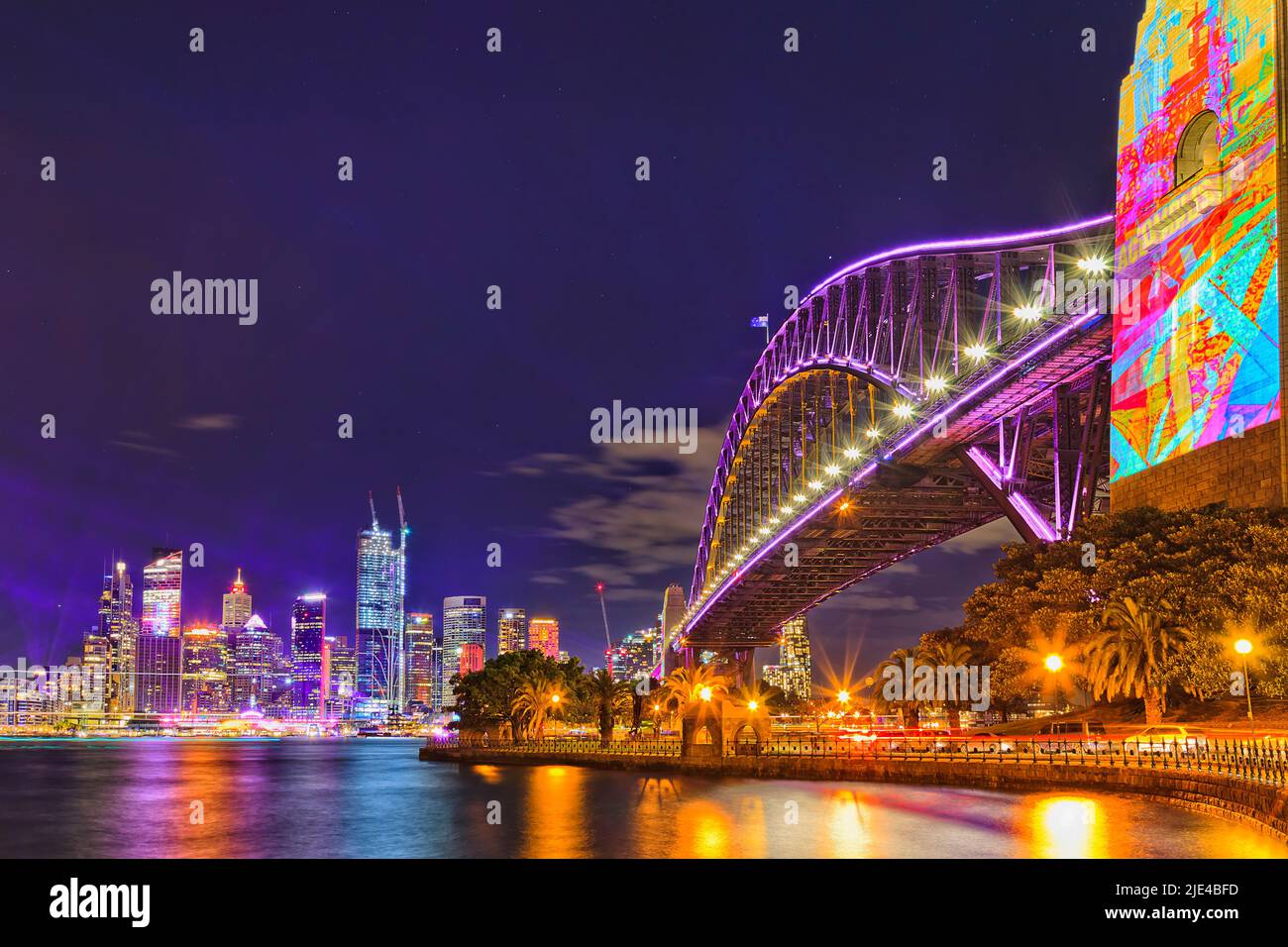 Bright illuminating light projection on Pylon of the Sydney Harbour bridge in Australia at Vivid Sydney festival. Stock Photo