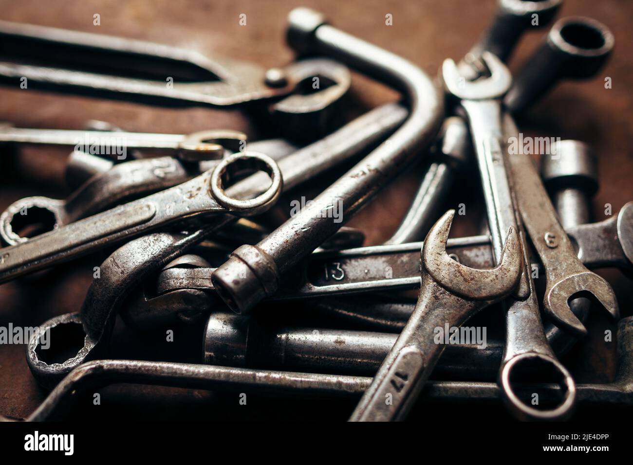 Set of old wrenches on a rusty metal background Stock Photo