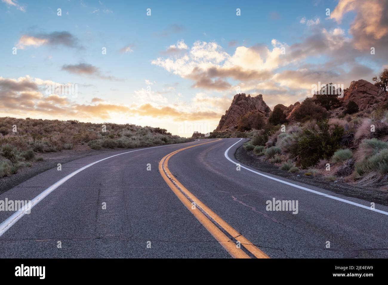 Scenic highway in the mountain landscape. Sunset Sky Stock Photo - Alamy