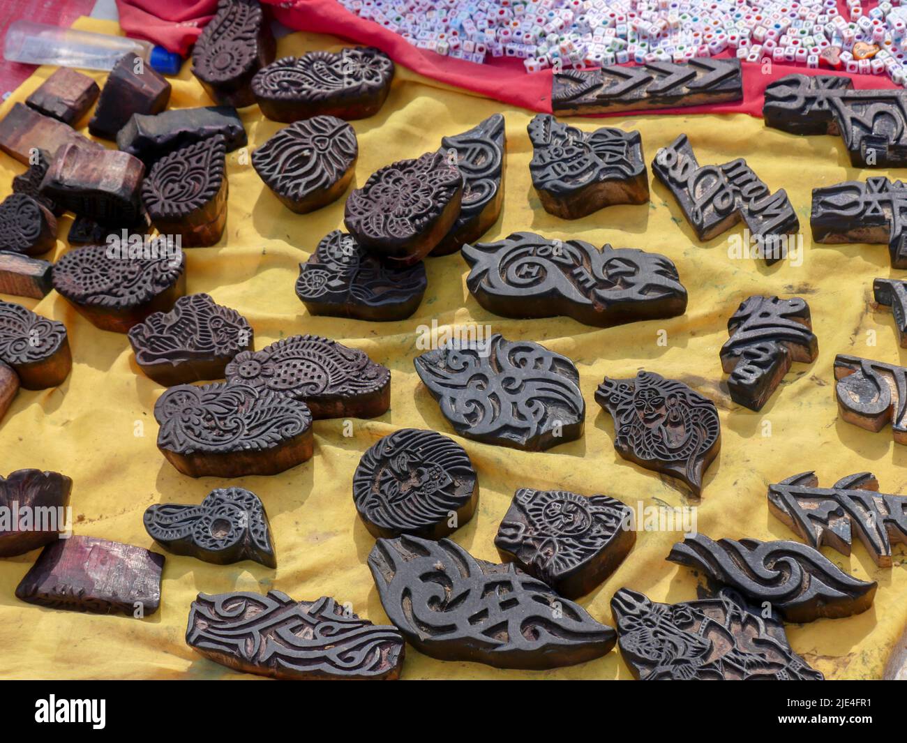 Wooden motifs blocks. Hand Carved Wooden Baren/Motif Printing Block for Artistic use for various works for painting, designing in rural villages Stock Photo