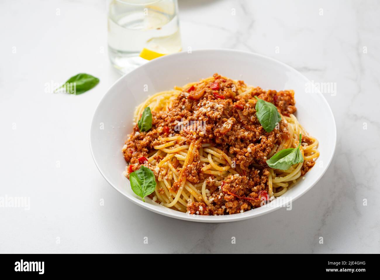 Close up of bolognese spaghetti tomato sauce basil food Stock Photo