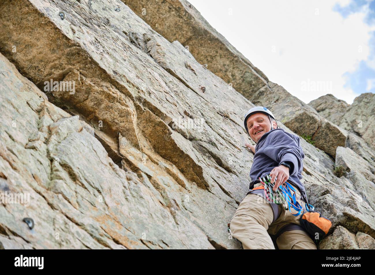 Man climbing a rock hi-res stock photography and images - Alamy