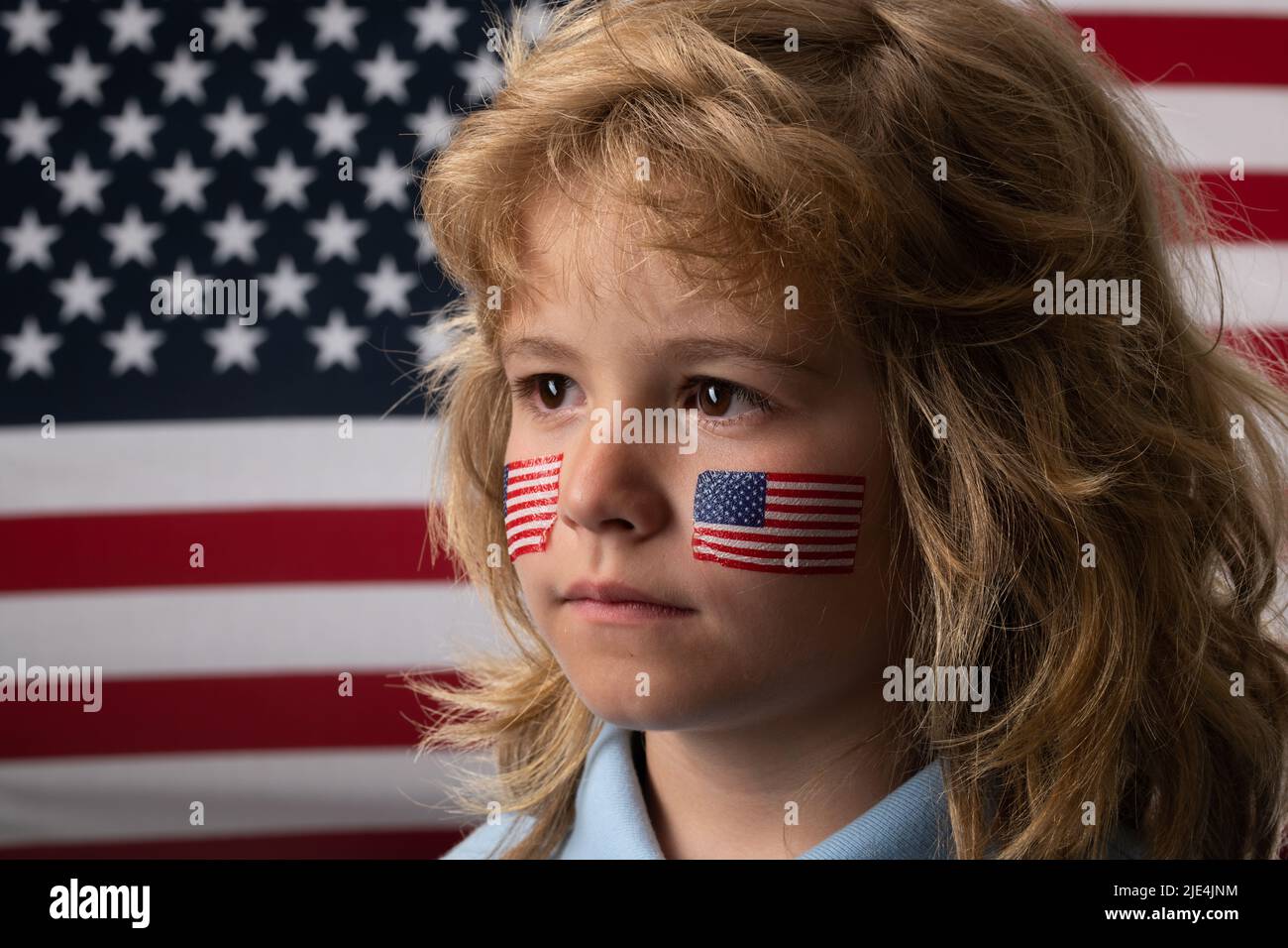 Independence day 4th of july. Child with american flag. American flag on kids cheek. Stock Photo