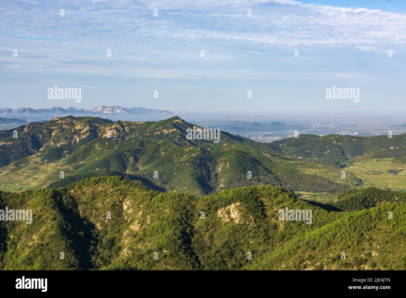 Surrounded by mountains forests hills mountains Stock Photo