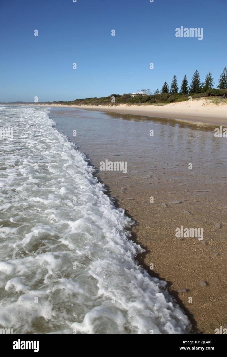 Pippies Beach - Yamba Australia. A wave rolls in across the beach at the popular tourist destination on NSW's north coast. Stock Photo