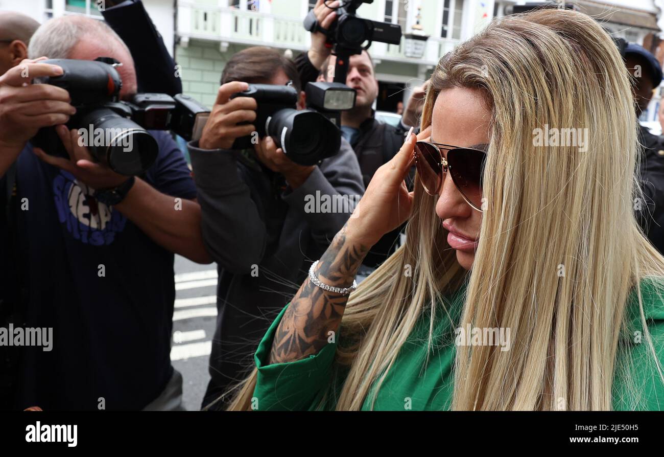 Lewes, UK 24th June 2022 : Reality TV star and former glamour model Katie Price and  fiancé Carl Woods arrive at Lewes Crown Court. Price is due to be sentenced today after pleading guilty to breaching a restraining order against her contacting her ex-husband's fiancée. Price sent abusive messages to Kieran Hayler about his fiancée, Michelle Penticost Lewes, UK 24th June 2022 : Reality TV star and former glamour model Katie Price and  fiancé Carl Woods leaving Lewes Crown Court after being sentenced. Lewes, UK 24th June 2022 : Reality TV star and former glamour model Katie Price and  fiancé Ca Stock Photo